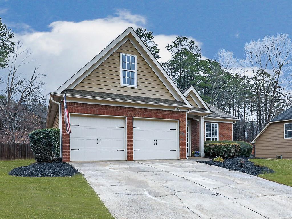 102 Springshade Court Canton, GA 30114 - Photo 34 of 78 a front view of a house with a yard garage and garage
