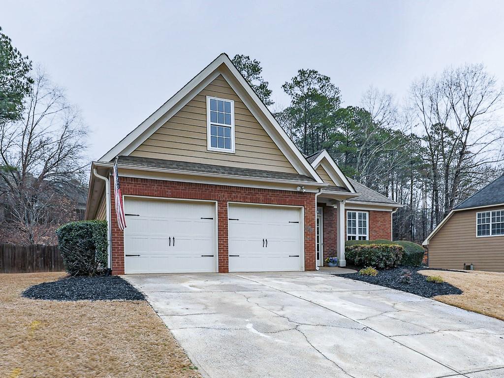 102 Springshade Court Canton, GA 30114 - Photo 35 of 78 a front view of a house with a yard and garage