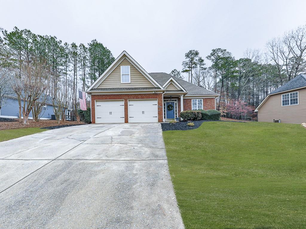 102 Springshade Court Canton, GA 30114 - Photo 37 of 78 a front view of a house with a yard and trees