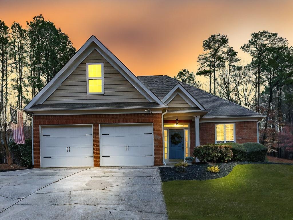 102 Springshade Court Canton, GA 30114 - Photo 38 of 78 a front view of a house with a yard and garage