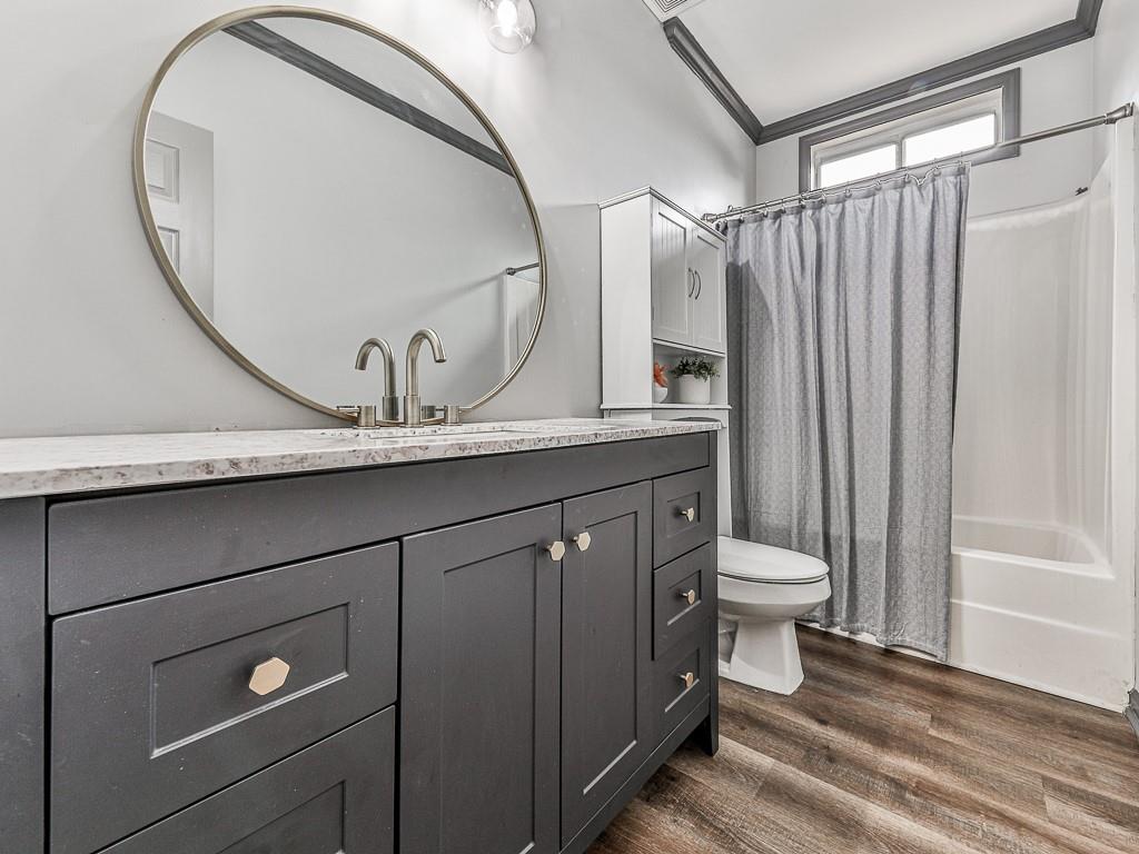 102 Springshade Court Canton, GA 30114 - Photo 4 of 78 a bathroom with a granite countertop sink a toilet and a mirror