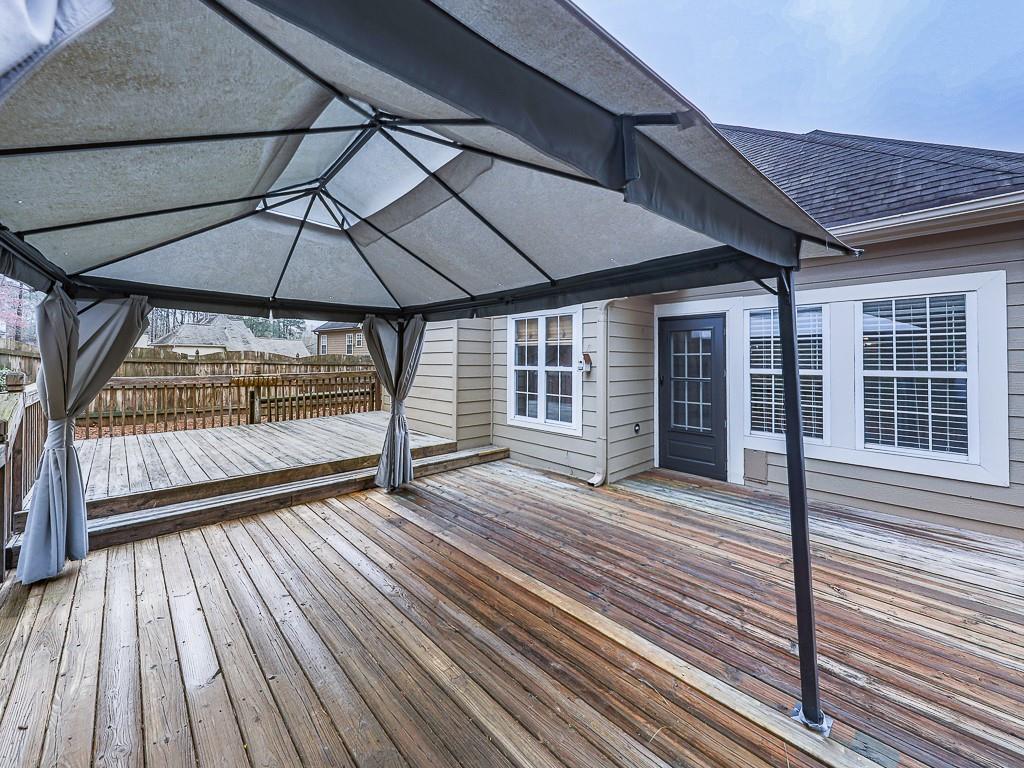 102 Springshade Court Canton, GA 30114 - Photo 44 of 78 a view of outdoor space with wooden floor and barbeque