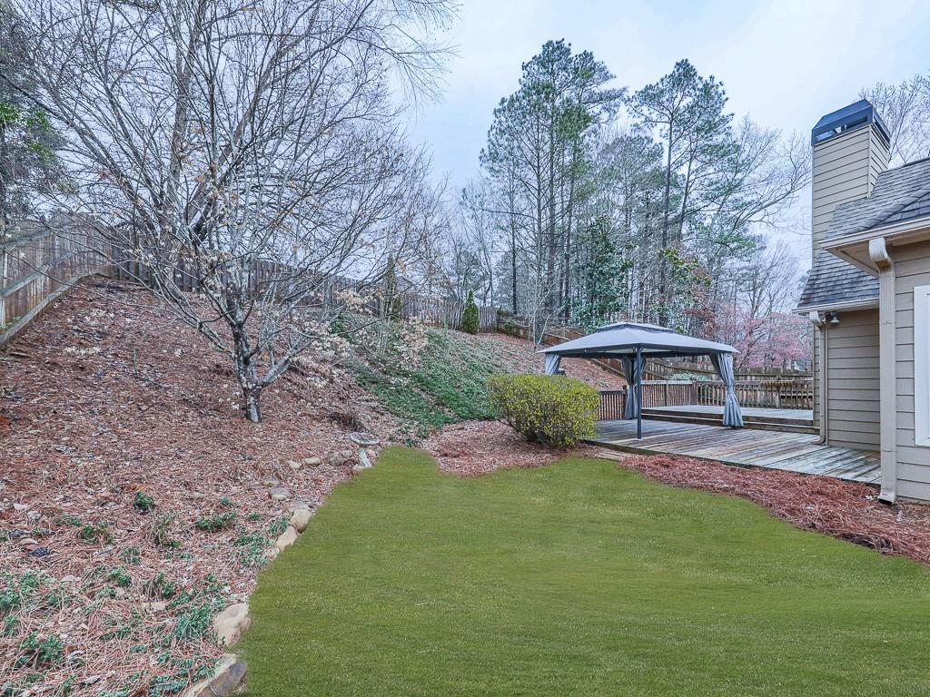 102 Springshade Court Canton, GA 30114 - Photo 50 of 78 a view of a patio with furniture and a yard