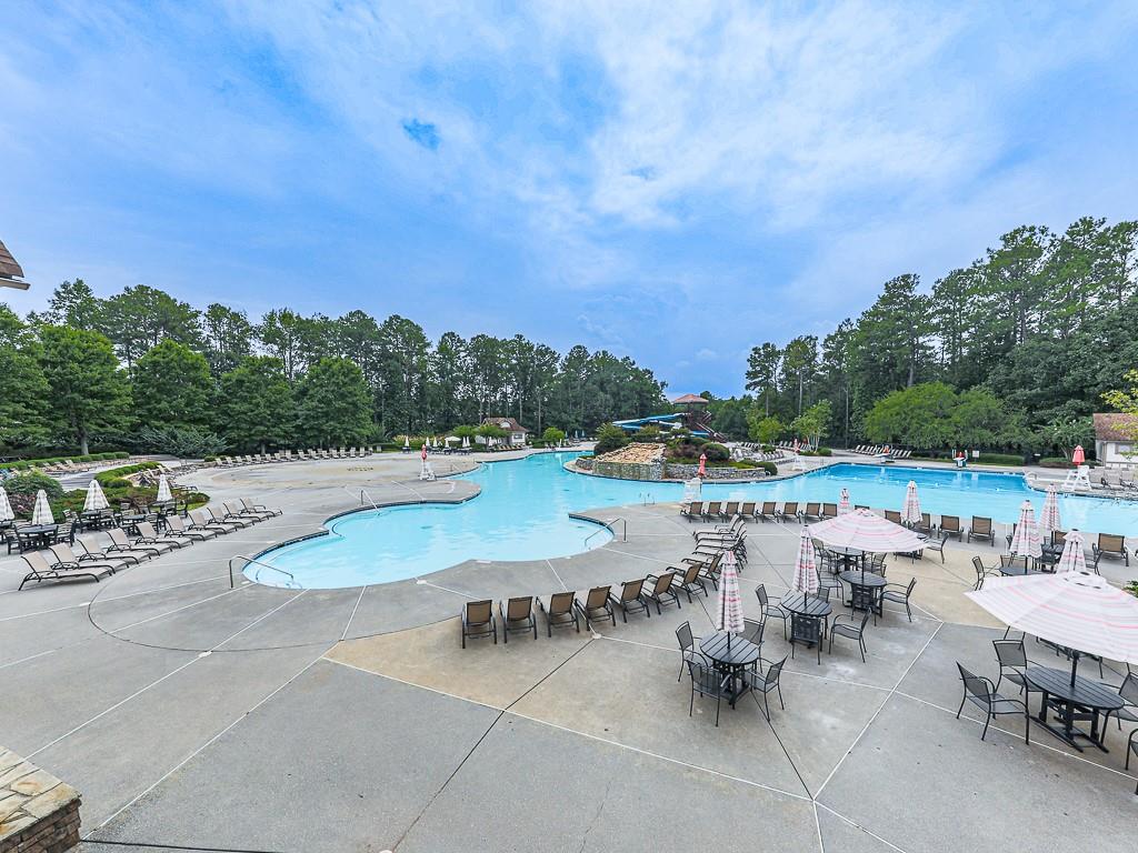 102 Springshade Court Canton, GA 30114 - Photo 53 of 78 a view of swimming pool with outdoor seating and a garden