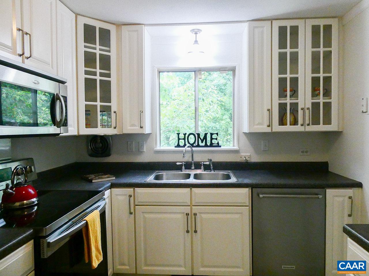 613 Shamrock Road Charlottesville, VA 22903 - Photo 15 of 42 a kitchen with a sink stove and cabinets