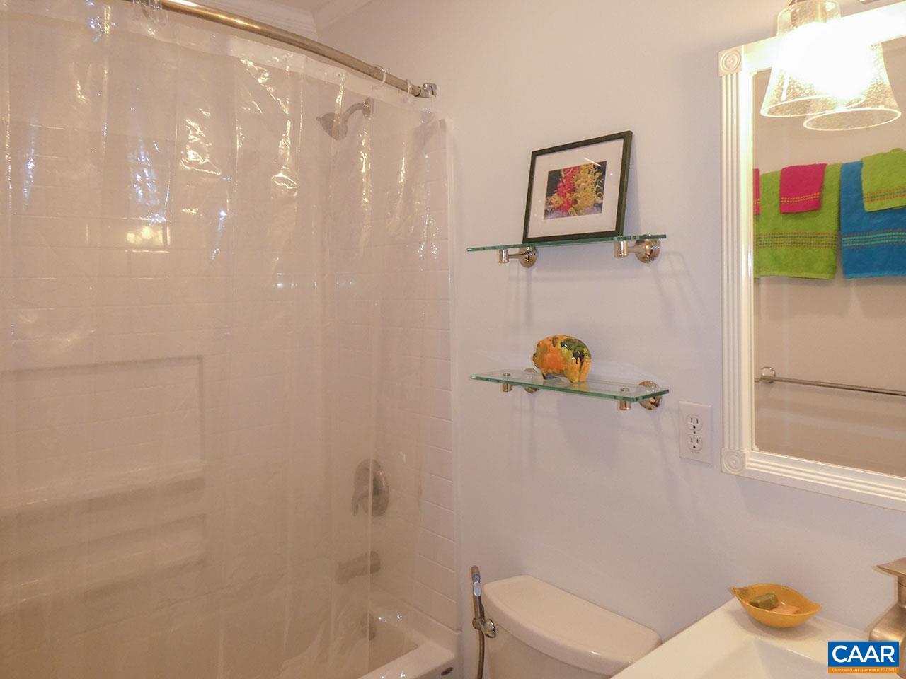 613 Shamrock Road Charlottesville, VA 22903 - Photo 28 of 42 a bathroom with a shower and a toilet next to a window