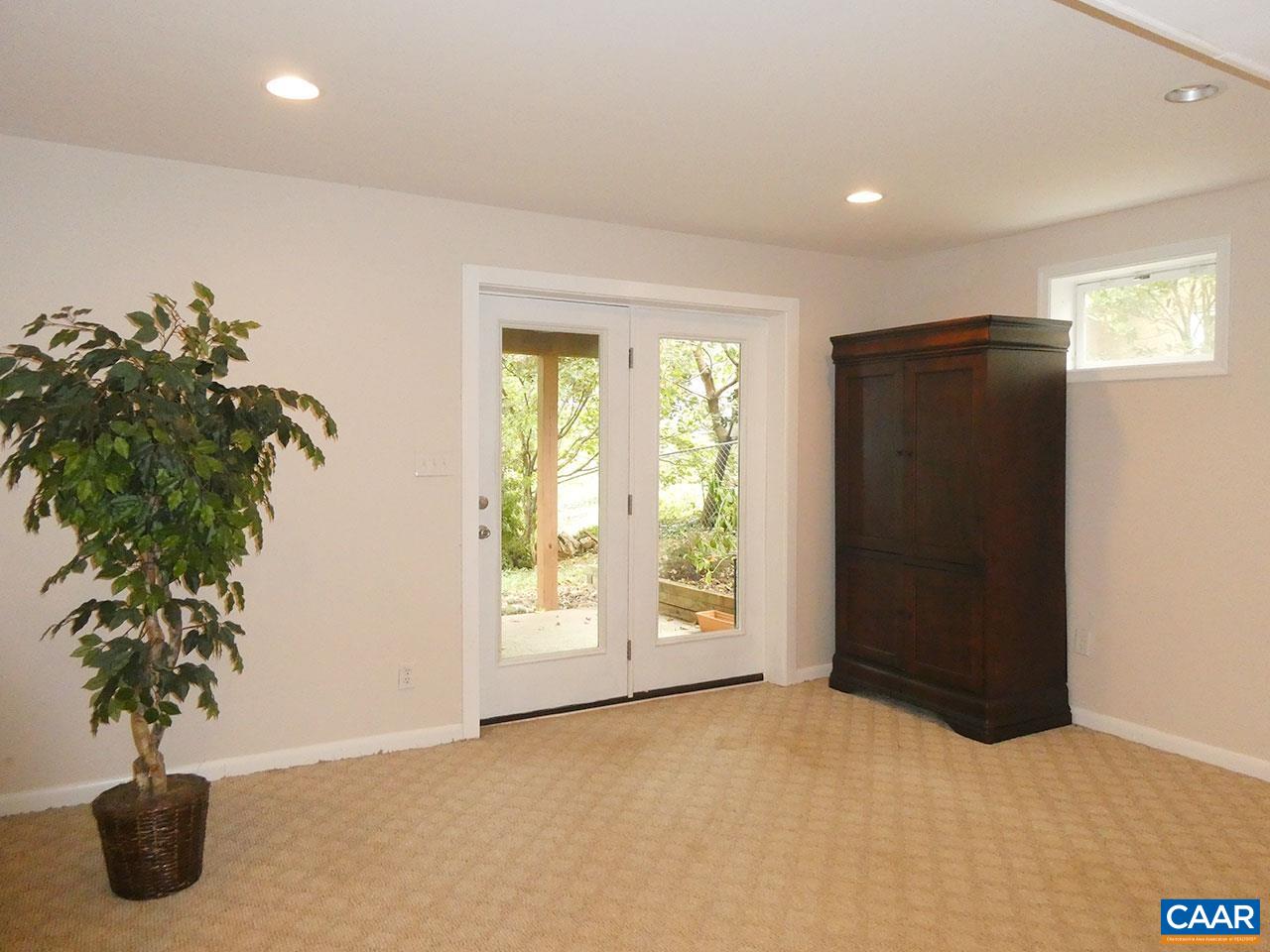 613 Shamrock Road Charlottesville, VA 22903 - Photo 33 of 42 a view of an empty room with windows and flower pot