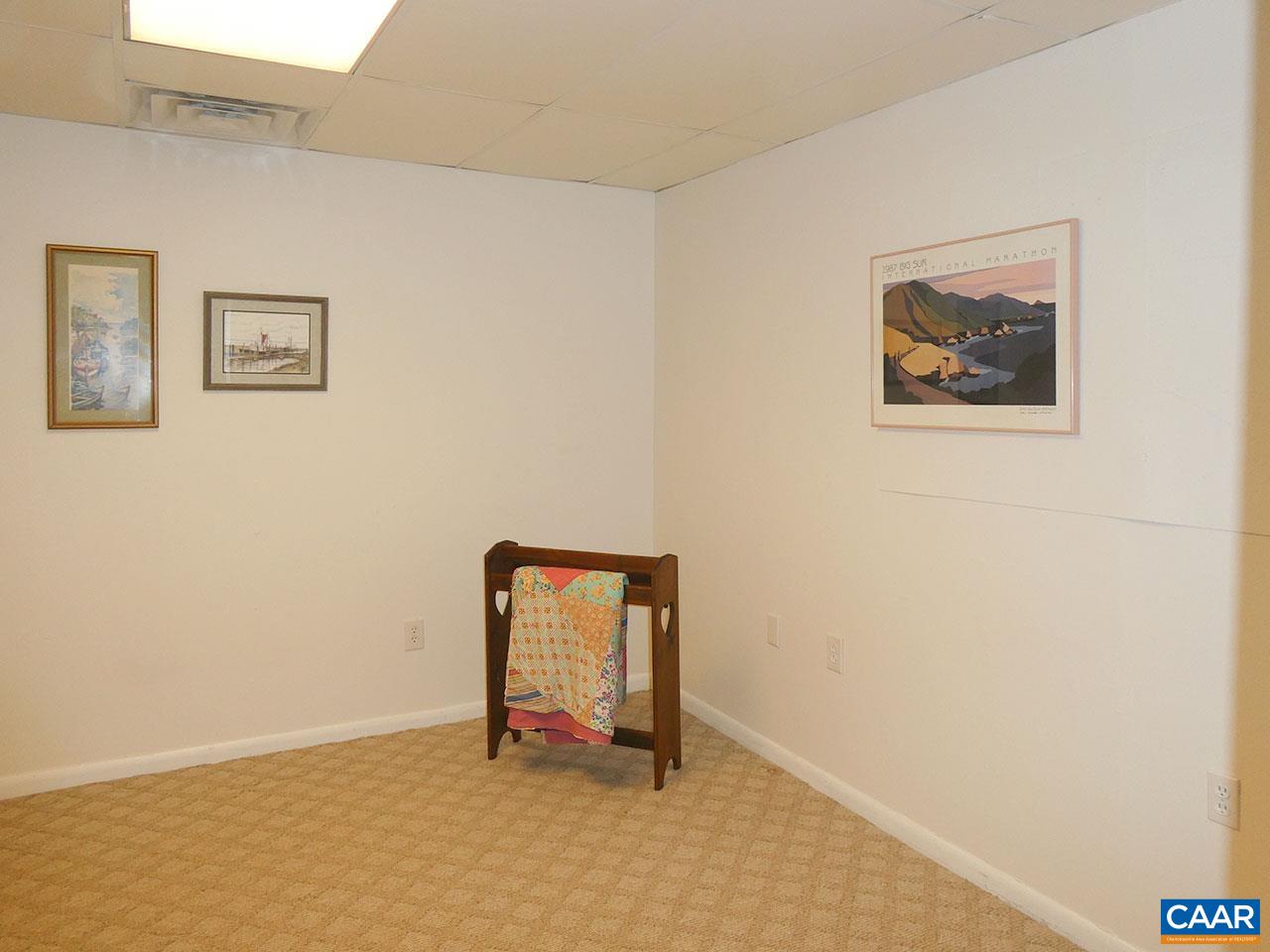 613 Shamrock Road Charlottesville, VA 22903 - Photo 34 of 42 a room with a bench