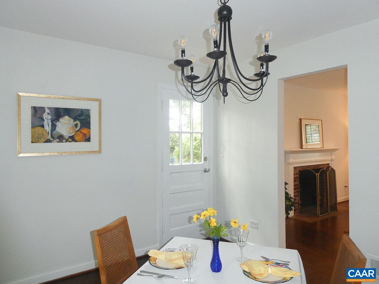 613 Shamrock Road Charlottesville, VA 22903 - Photo 7 of 42 a view of a dining room with furniture a chandelier and wooden floor
