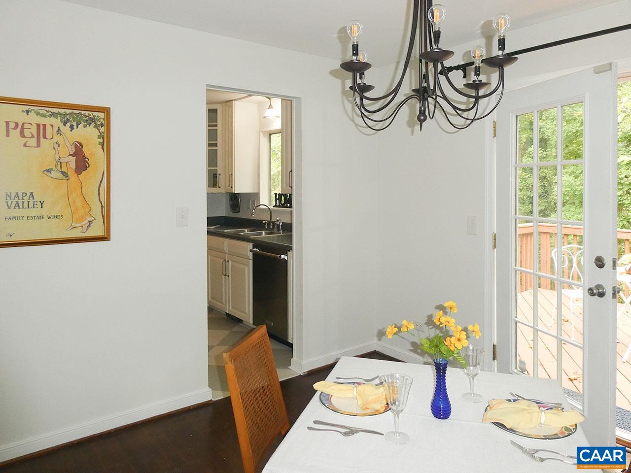 613 Shamrock Road Charlottesville, VA 22903 - Photo 8 of 42 a view of a dining area with furniture window and wooden floor