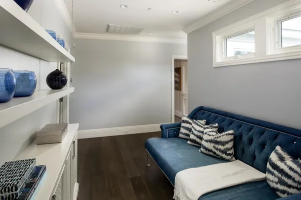 a spacious bedroom with a bed and a window