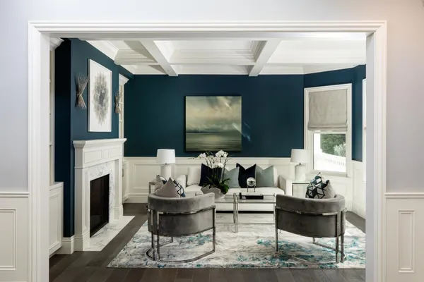 a living room with fireplace furniture and a flat screen tv