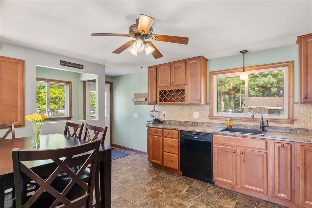 3 Norman Road Billerica, MA 01821 - Photo 11 of 28 a kitchen with granite countertop a sink a center island and furniture
