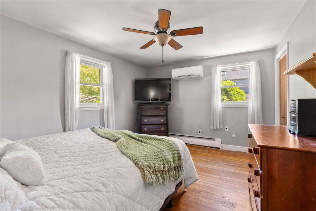 3 Norman Road Billerica, MA 01821 - Photo 13 of 28 a bedroom with a bed and a flat screen tv