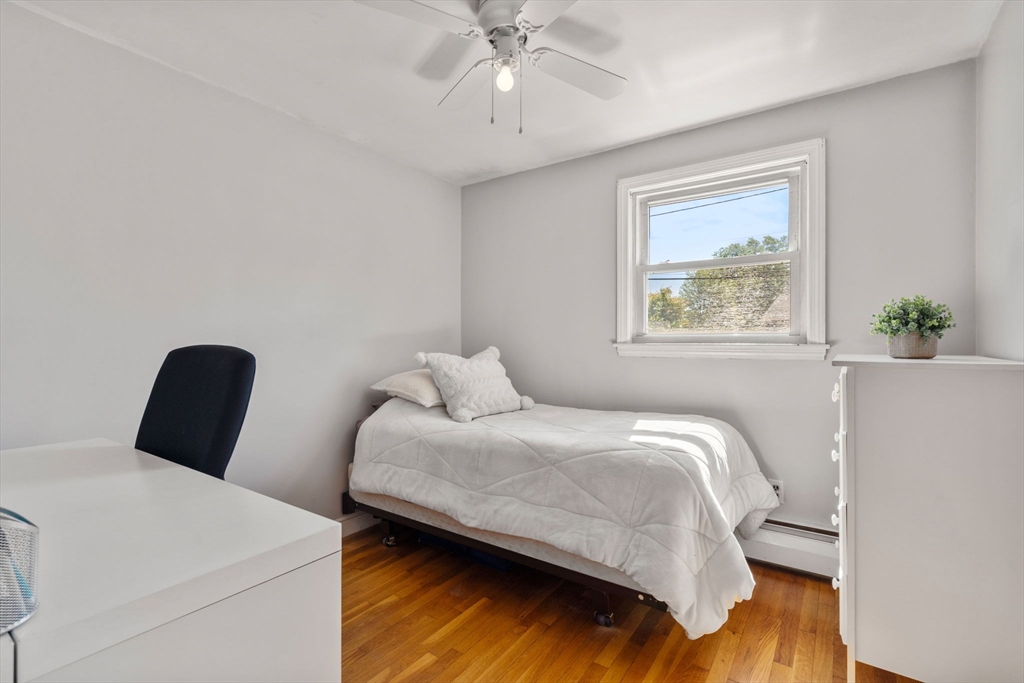 3 Norman Road Billerica, MA 01821 - Photo 15 of 28 a bedroom with a bed and a chandelier