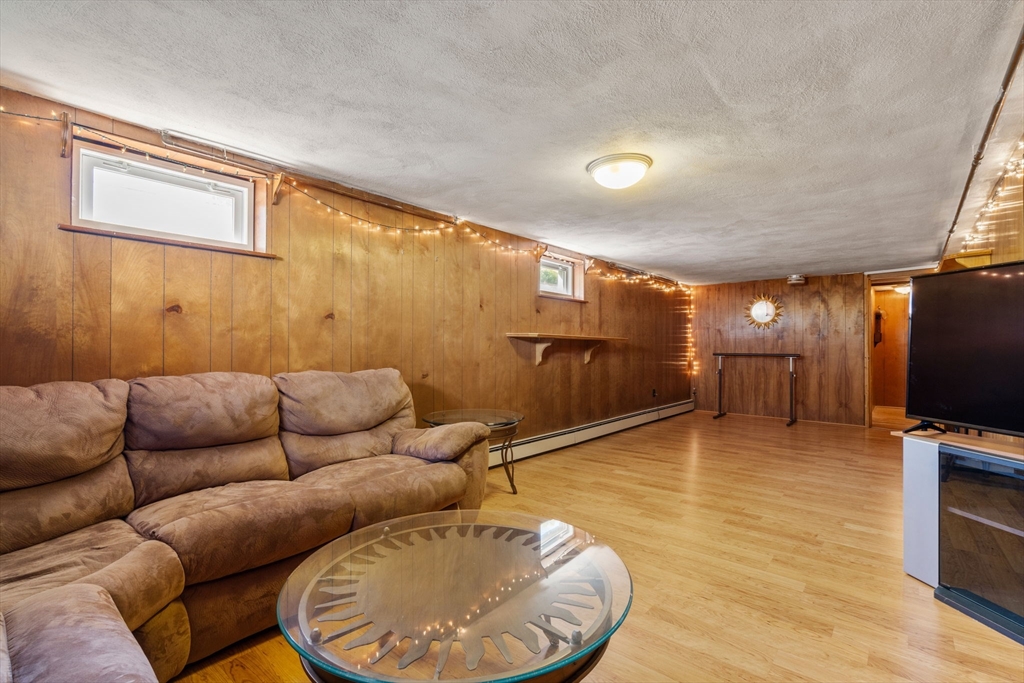 3 Norman Road Billerica, MA 01821 - Photo 20 of 28 a living room with furniture and a flat screen tv