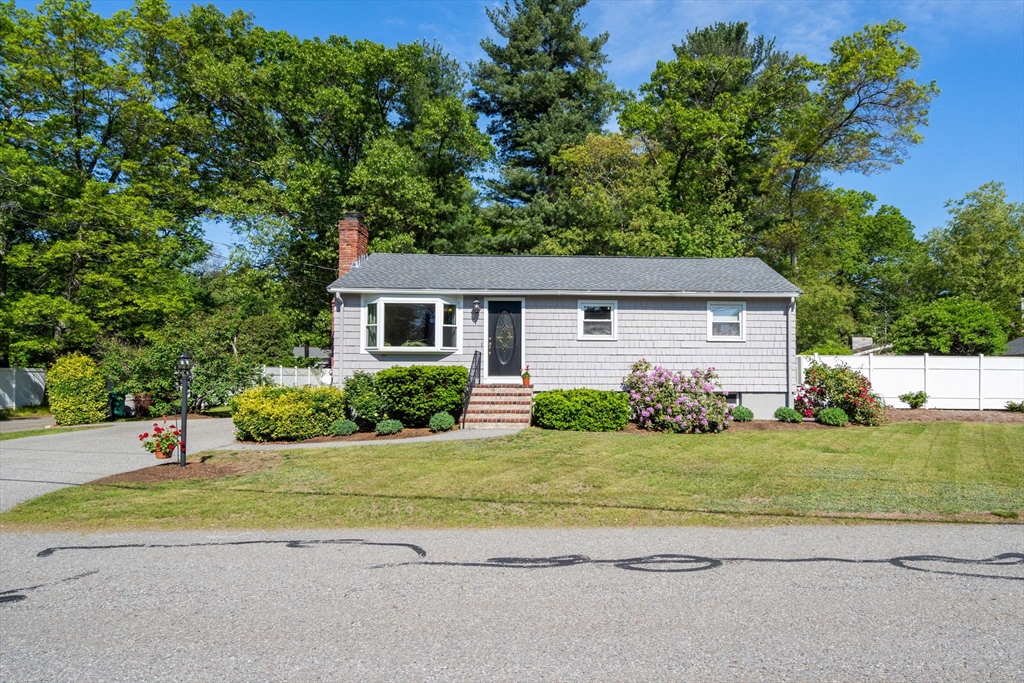 3 Norman Road Billerica, MA 01821 - Photo 2 of 28 a front view of a house with a yard and garage