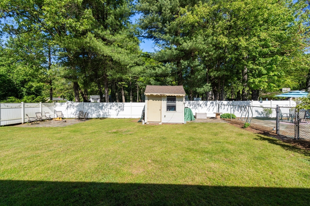 3 Norman Road Billerica, MA 01821 - Photo 22 of 28 a view of a swimming pool with an outdoor seating and a yard