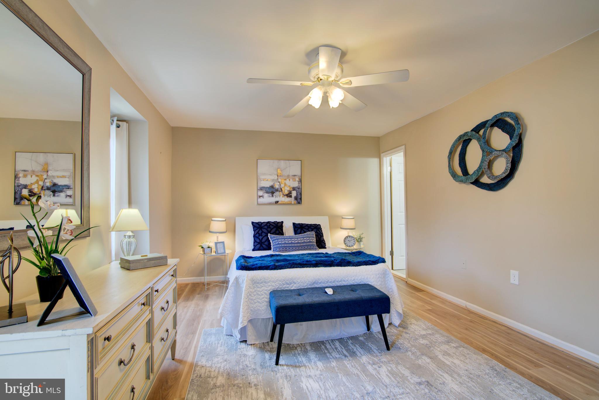 5903 Kara Place Burke, VA 22015 - Photo 19 of 45 a living room with furniture and a wooden floor