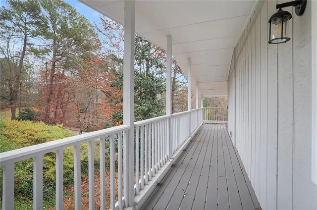 a view of a balcony with wooden floor