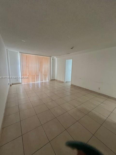 13499 Biscayne Boulevard, Unit 602 North Miami, FL 33181 - Photo 5 of 14 a view of an empty room with a window