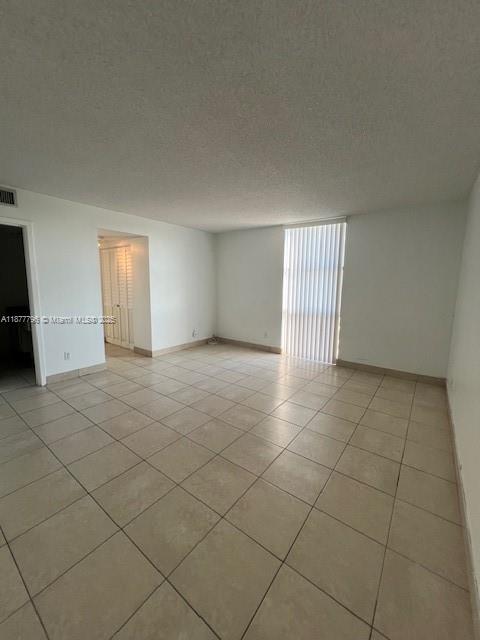 13499 Biscayne Boulevard, Unit 602 North Miami, FL 33181 - Photo 6 of 14 a view of an empty room and a window