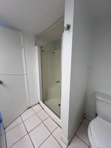 a bathroom with a sink a mirror and a shower