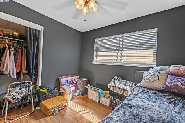 a bedroom with bed and a window