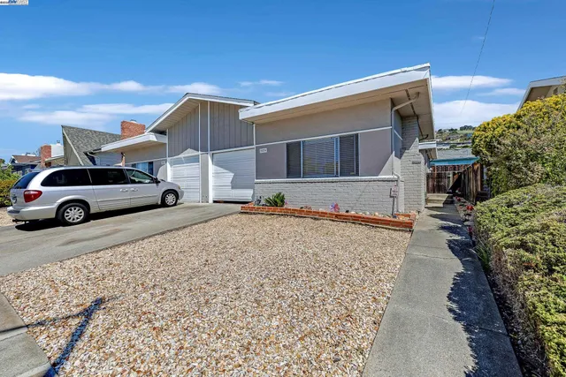 a view of a car park in front of a building