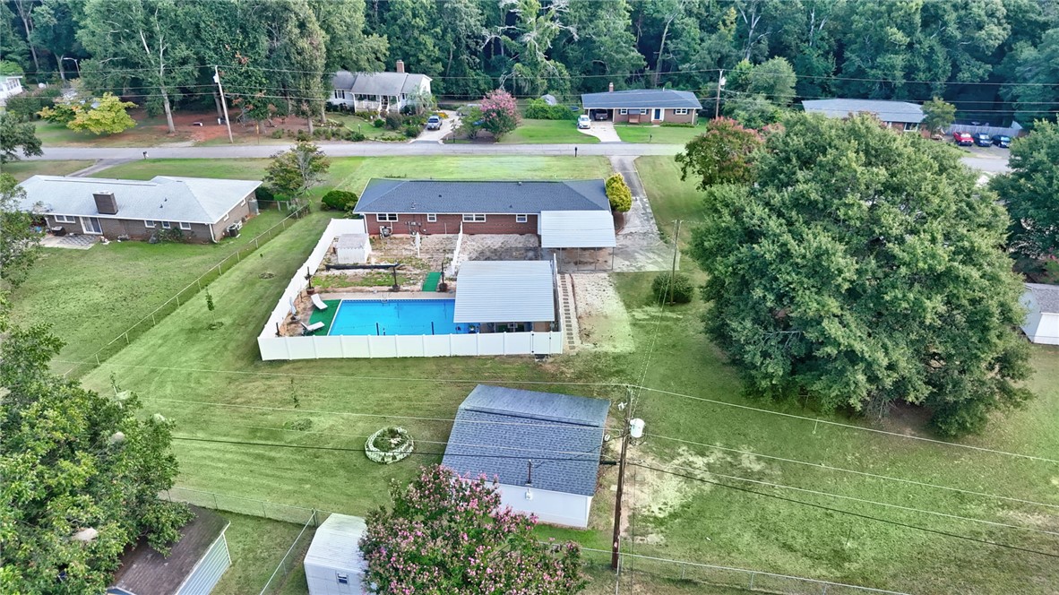 121 Wilson Road Anderson, SC 29625 - Photo 36 of 40 A spacious backyard features an inviting swimming pool surrounded by a secure privacy fence.