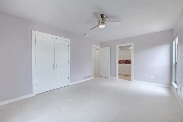 a view of an empty room with a bathroom