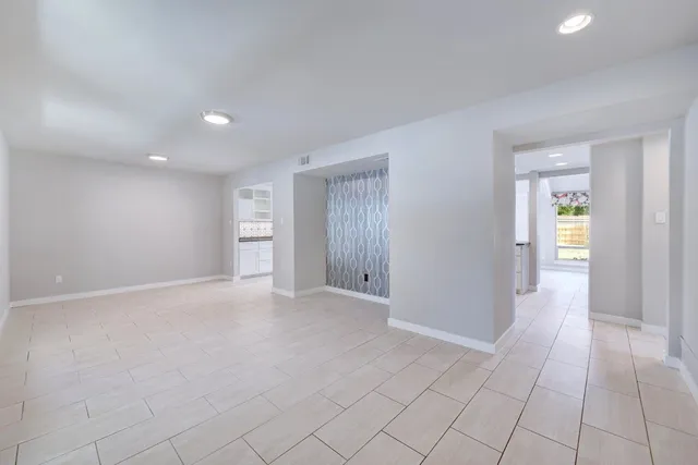 a view of an empty room and window