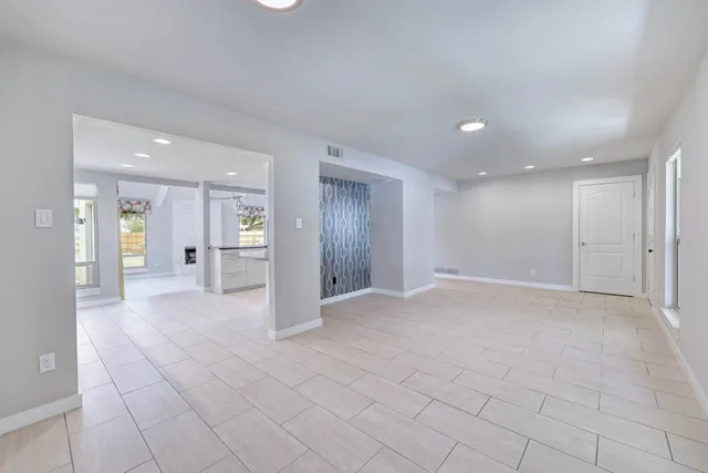 a view of an empty room and a entryway