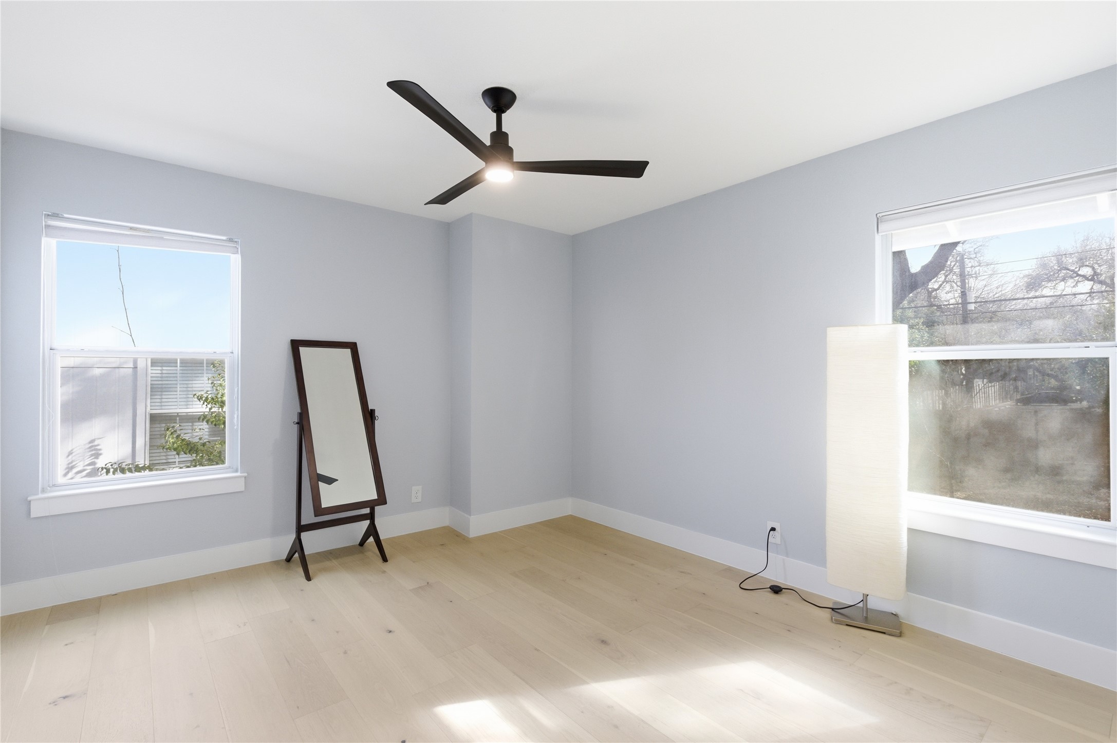501 Lightsey Road Austin, TX 78704 - Photo 18 of 40 a view of room with window and a ceiling fan