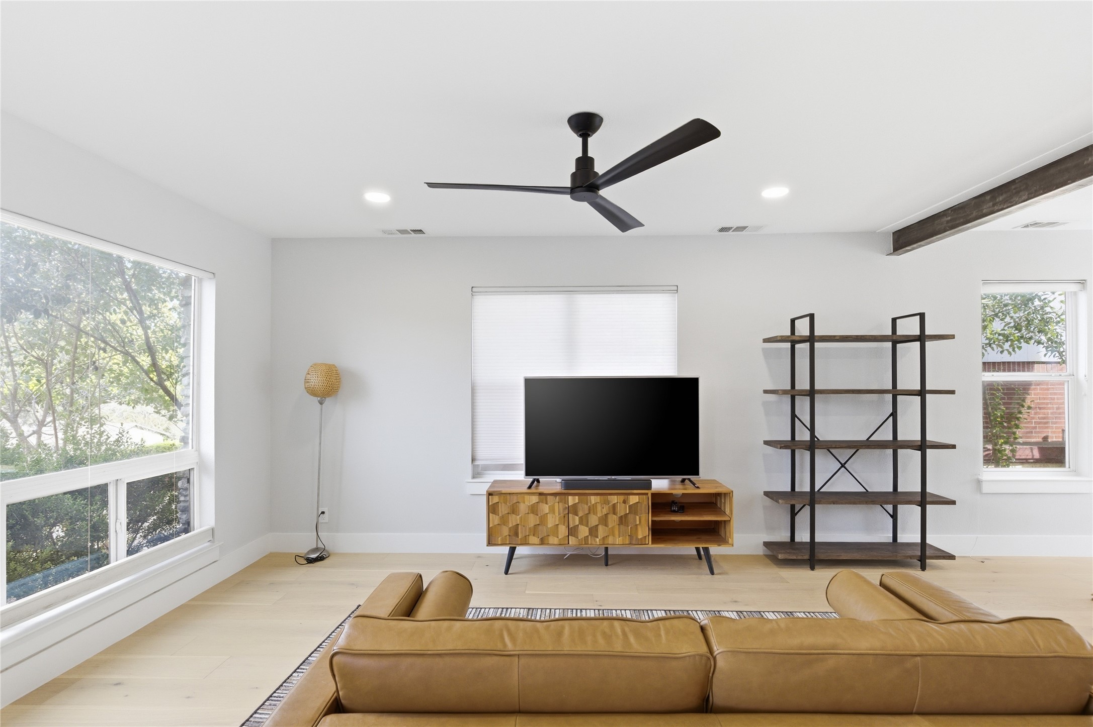 501 Lightsey Road Austin, TX 78704 - Photo 25 of 40 a living room with furniture and a flat screen tv