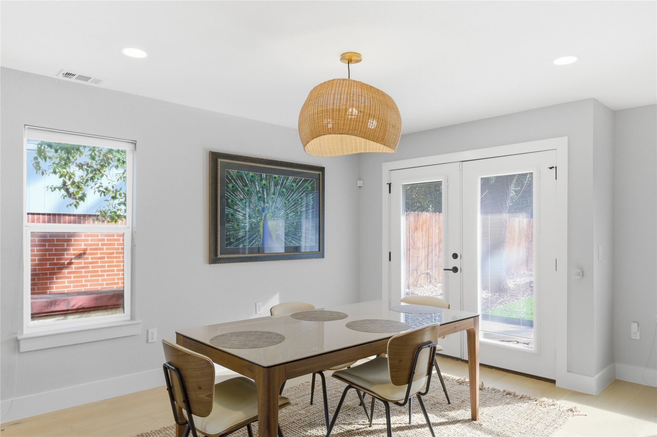 501 Lightsey Road Austin, TX 78704 - Photo 26 of 40 a view of a dining room that has a table and a chandelier