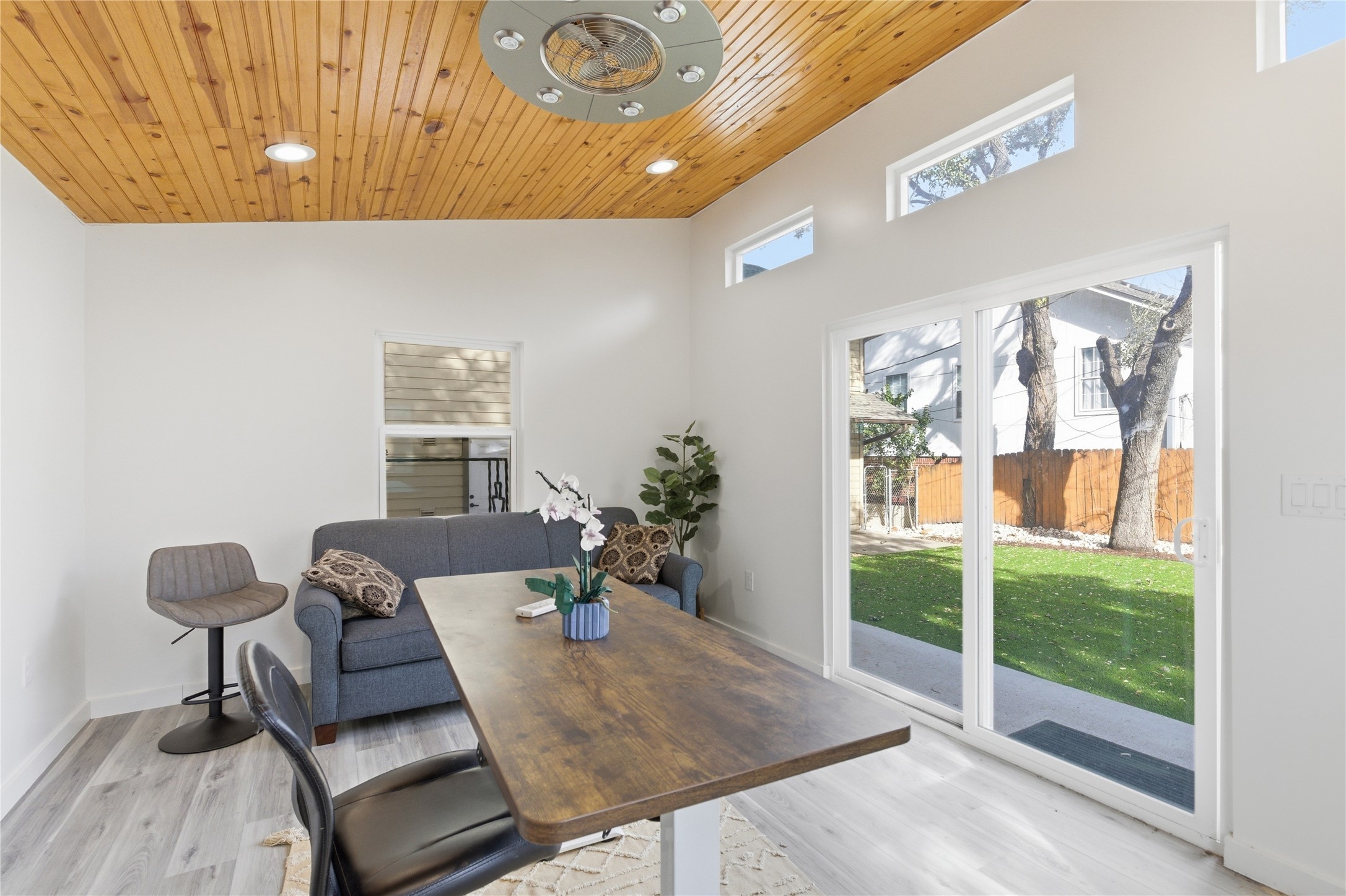 501 Lightsey Road Austin, TX 78704 - Photo 27 of 40 a living room with furniture and a floor to ceiling window