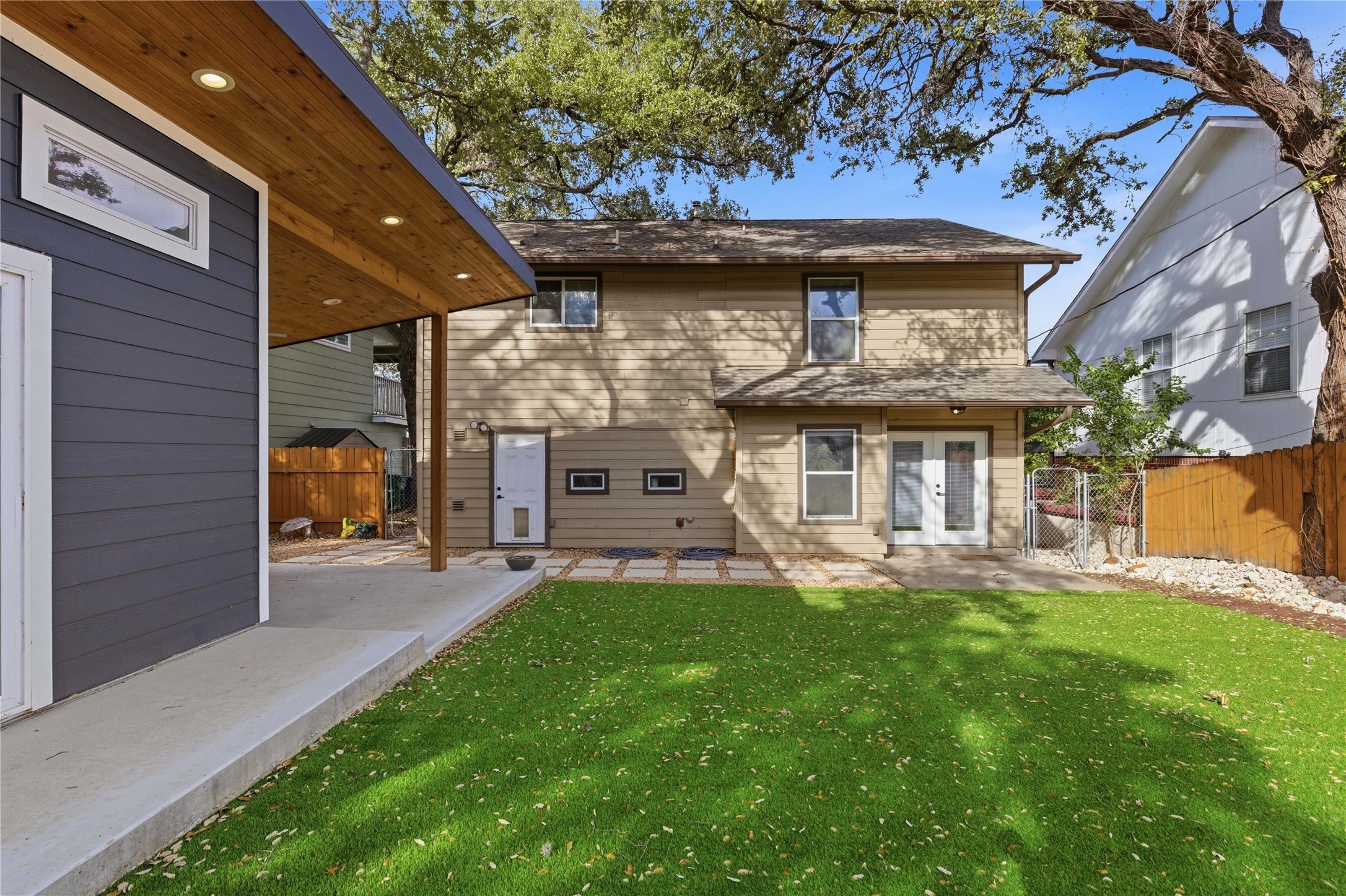 501 Lightsey Road Austin, TX 78704 - Photo 28 of 40 a front view of a house with a garden and patio
