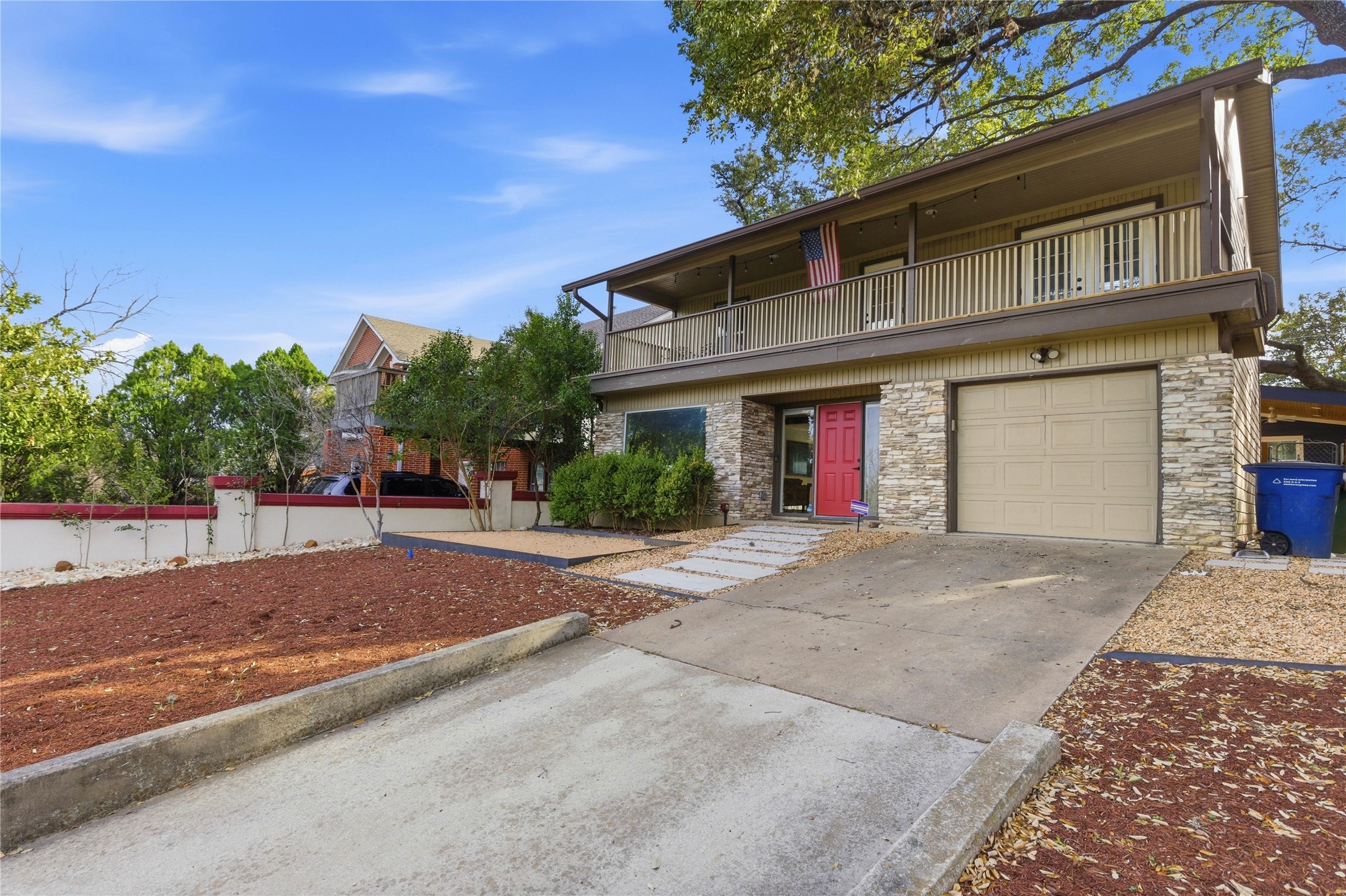 501 Lightsey Road Austin, TX 78704 - Photo 3 of 40 a front view of a house with a yard and garage