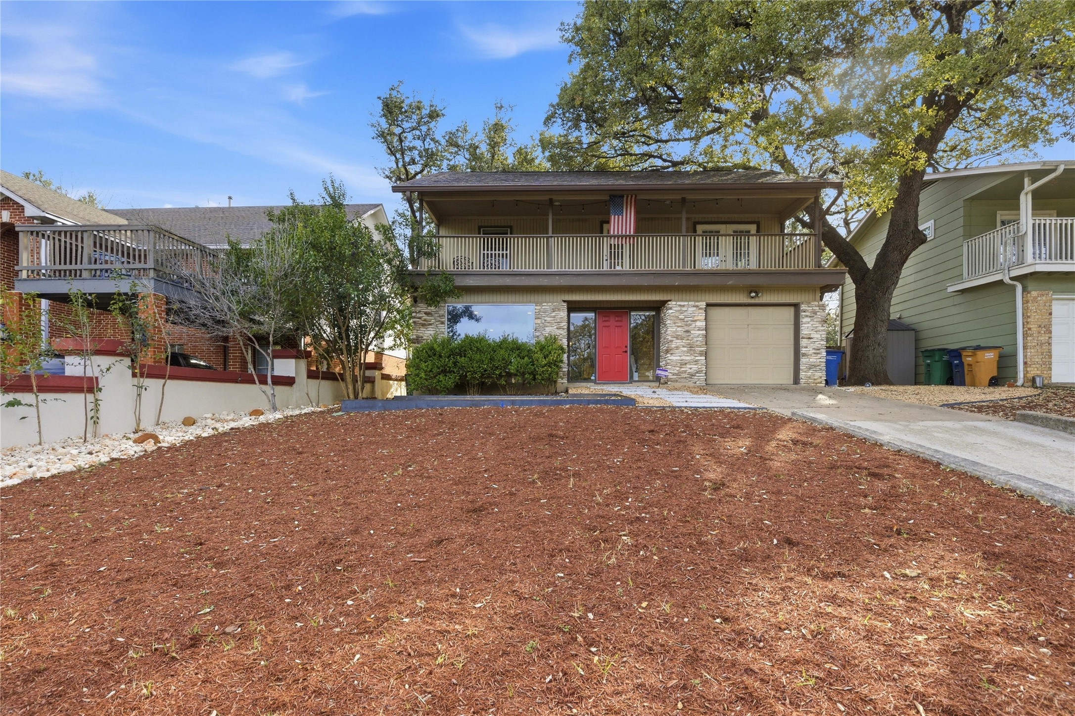 501 Lightsey Road Austin, TX 78704 - Photo 31 of 40 a front view of a house with a yard and garage