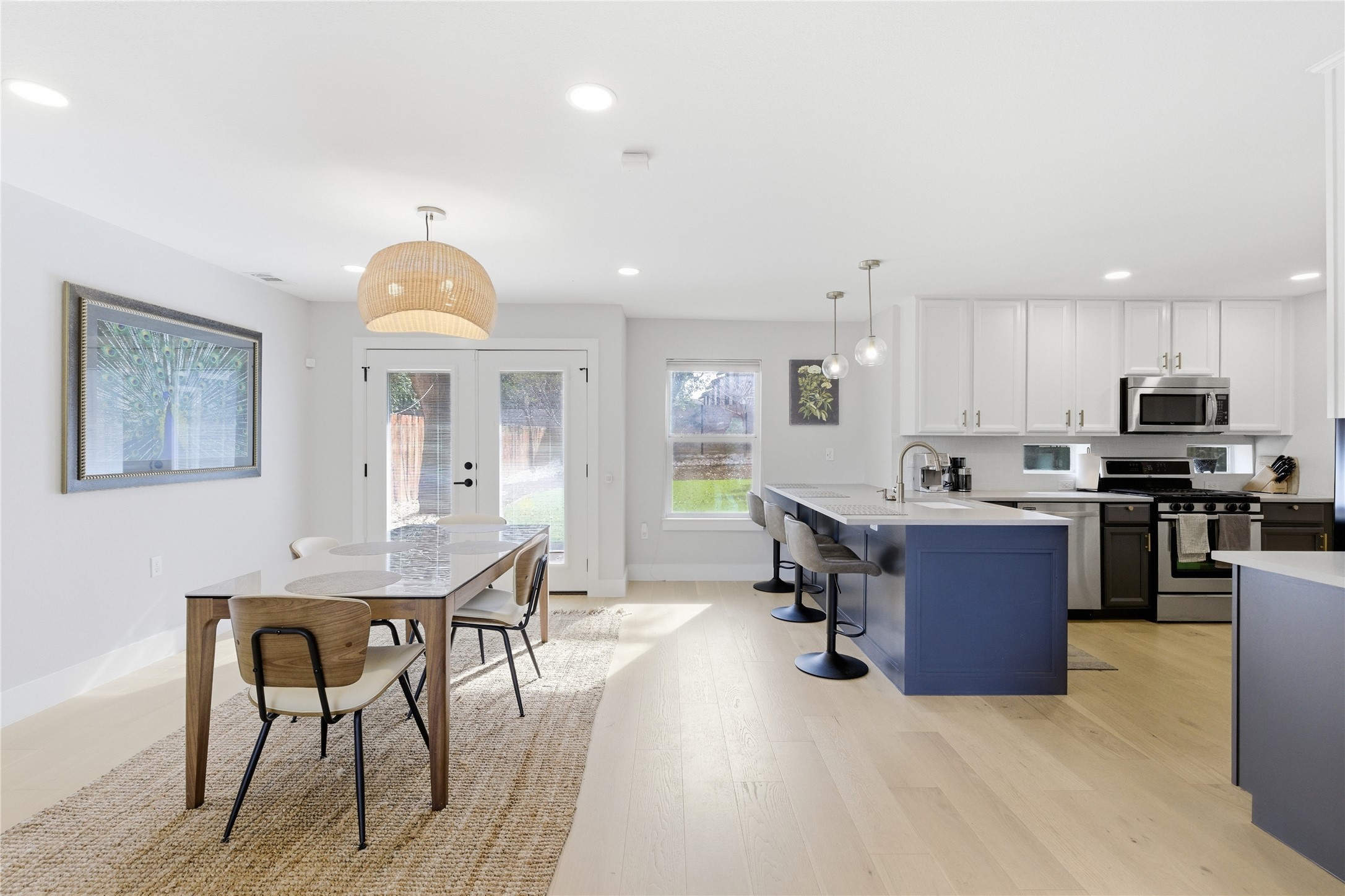 501 Lightsey Road Austin, TX 78704 - Photo 32 of 40 a view of kitchen with stainless steel appliances granite countertop a stove a sink a dining table and chairs