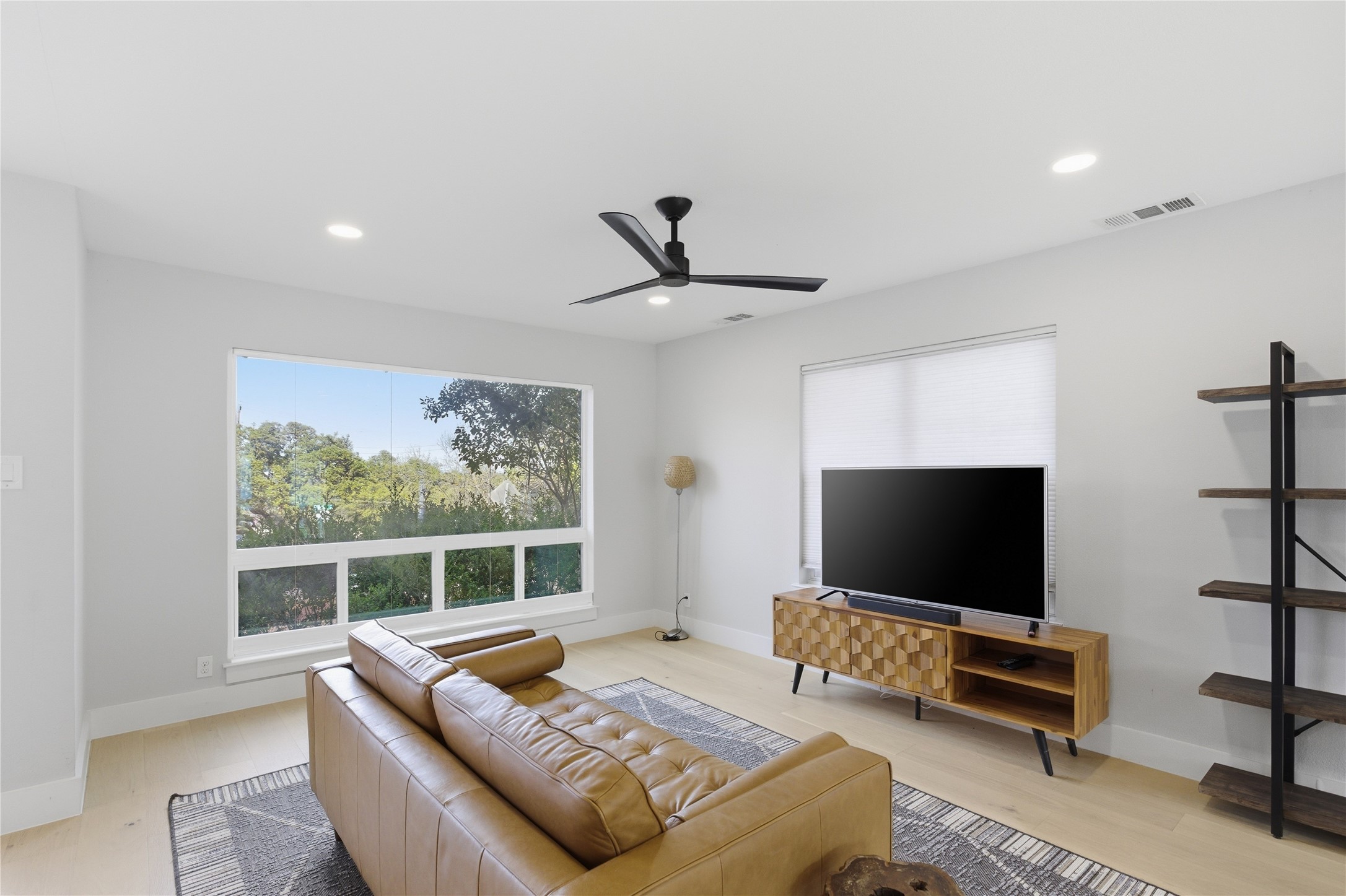 501 Lightsey Road Austin, TX 78704 - Photo 38 of 40 a living room with furniture and a flat screen tv