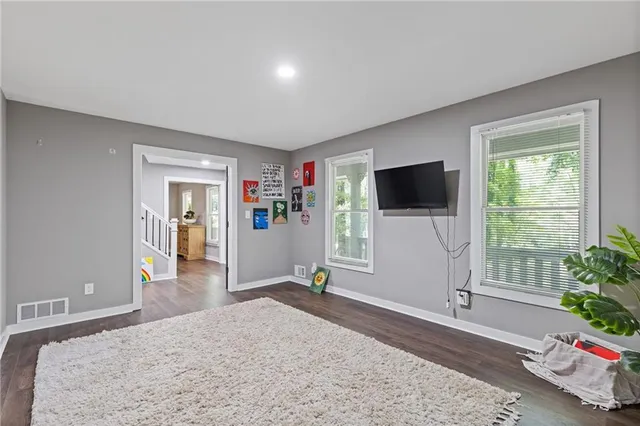 a view of entryway with wooden floor and windows
