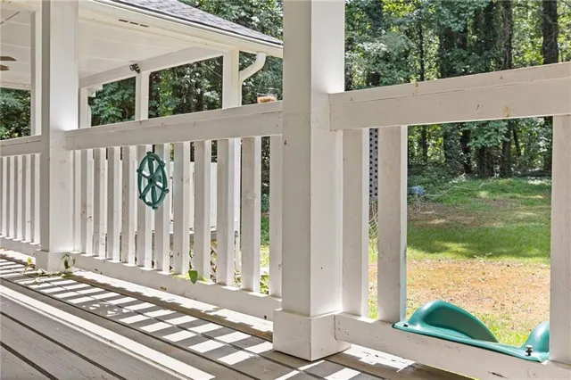 a front view of a house with a yard balcony