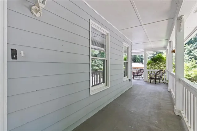 a view of a porch with furniture