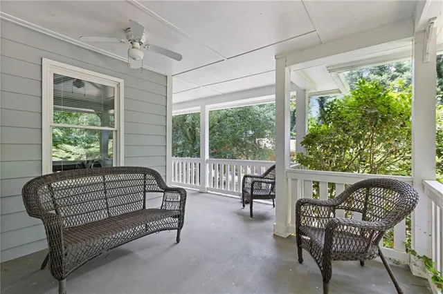 a balcony with furniture and a window