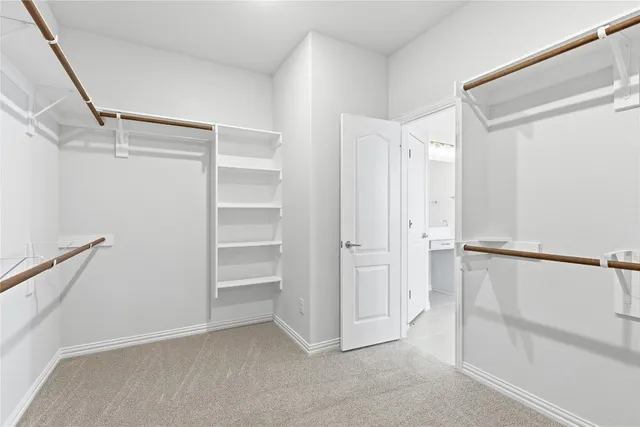 a view of an empty walk in closet
