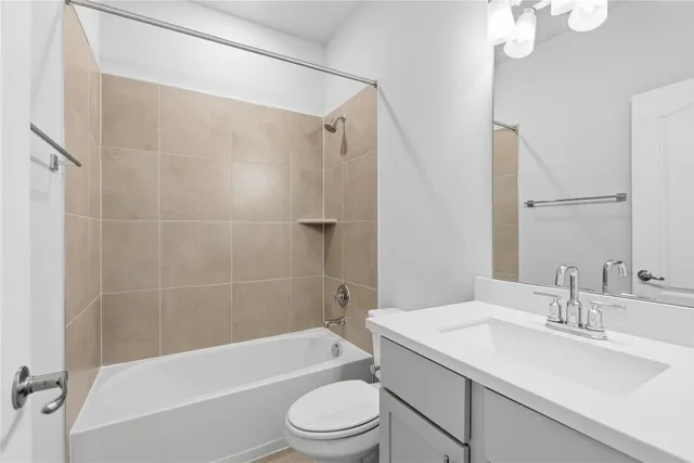 a bathroom with a sink a toilet and a bathtub