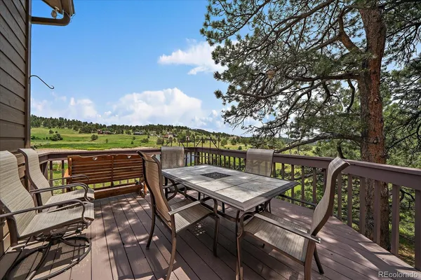 a view of a chairs and table on the terrace