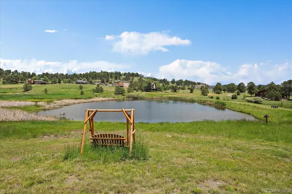 a view of lake with houses in the back